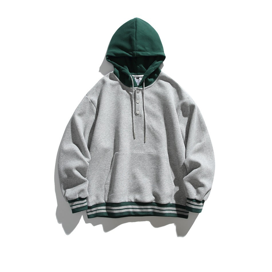 Flat-lay hoodie in heather gray with green hood, snap placket, kangaroo pocket and green striped ribbed trim