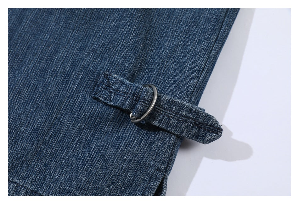 Close-up of a denim tab threaded through a dark metal ring.