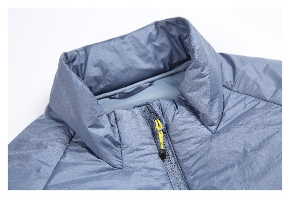Close-up of the jacket's raised collar and front zipper with a yellow-and-black zipper pull.