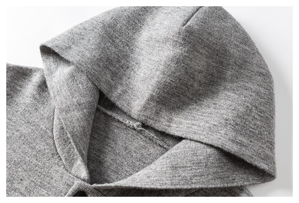 Close-up of a heather gray hood, showing the opening, inner seam, and stitching.