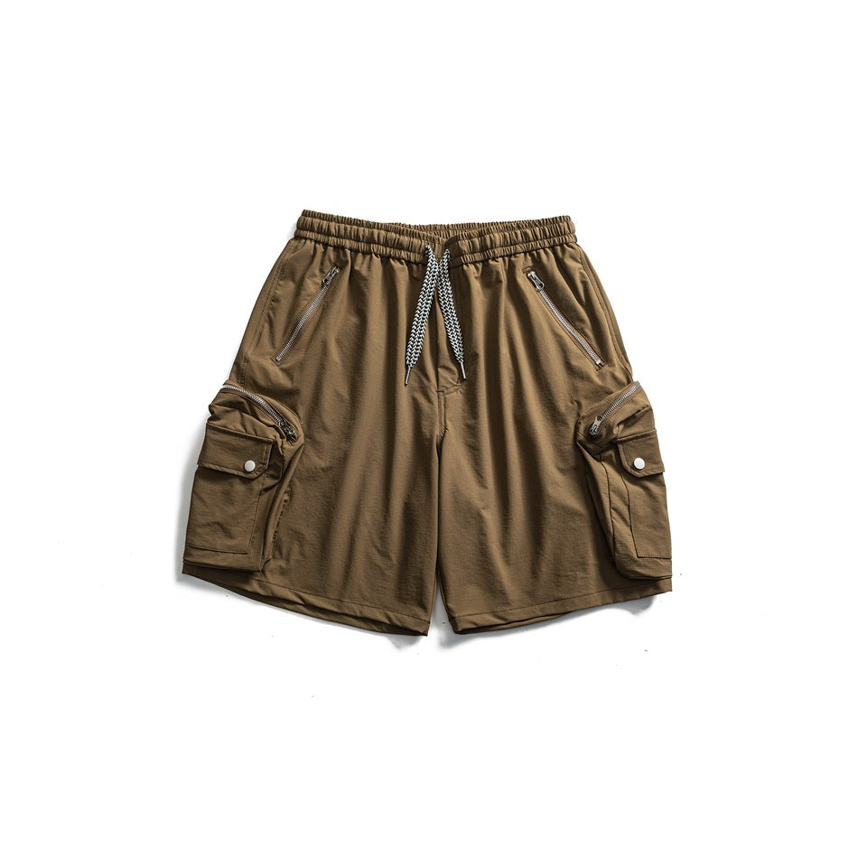 Brown cargo shorts flat lay with drawstring waist, zippered front pockets and snap-flap side cargo pockets