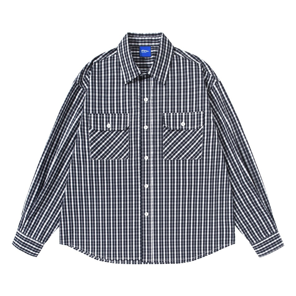Black and white plaid long-sleeve button-up shirt with two flap chest pockets, front view