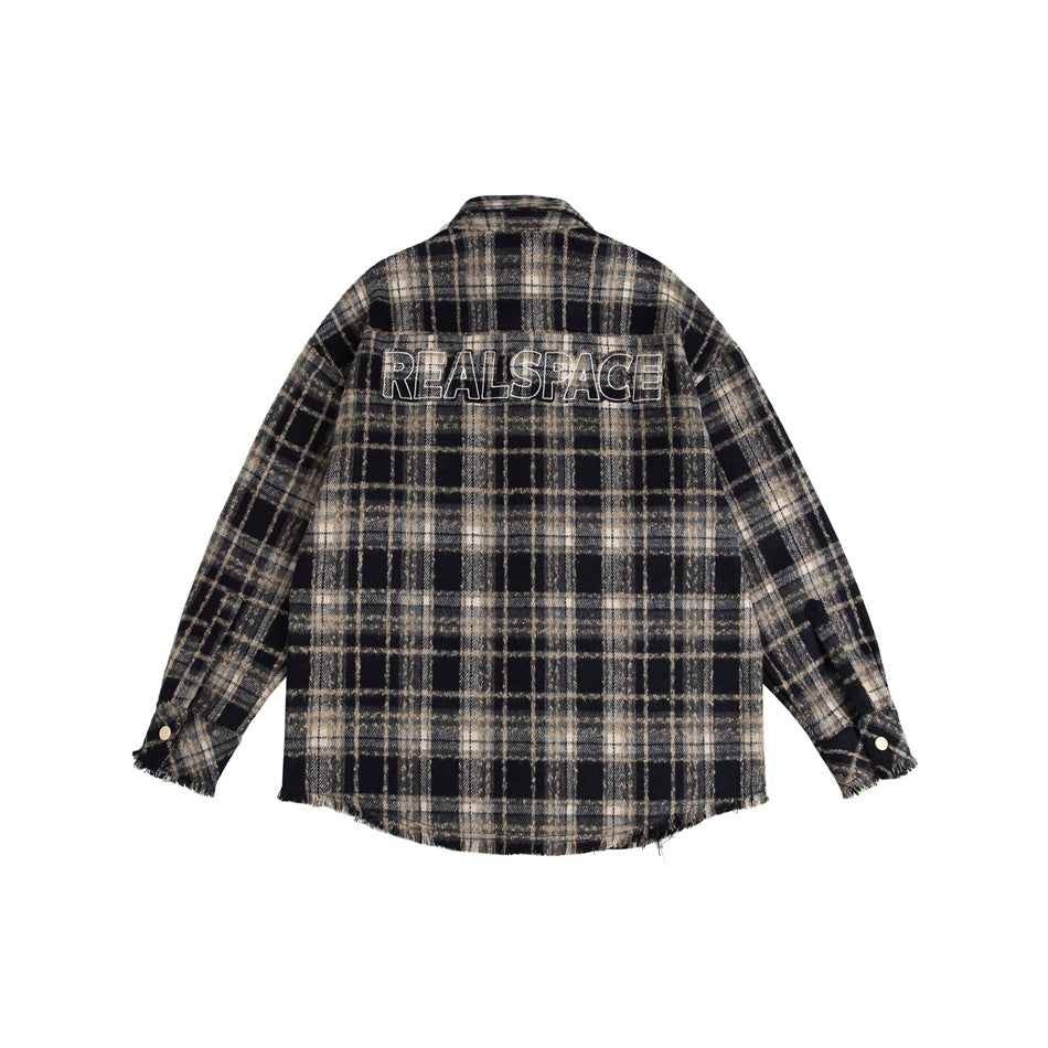 Back of a black and beige plaid shirt jacket, shown flat with outlined lettering across the upper back.