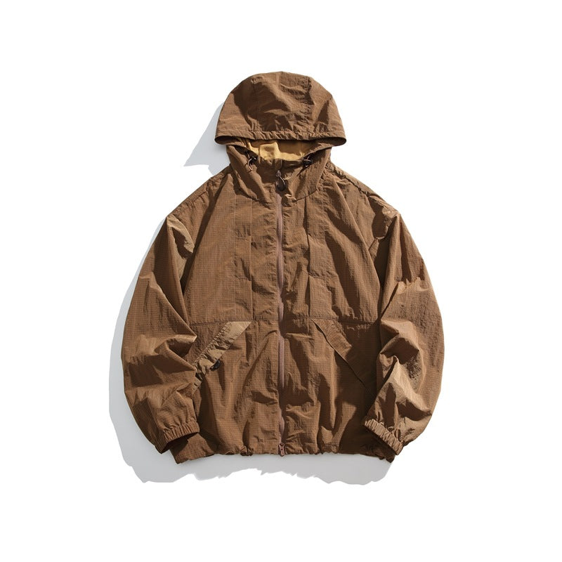Brown hooded zip-up jacket with angled pocket seams and elastic cuffs, flat lay front view
