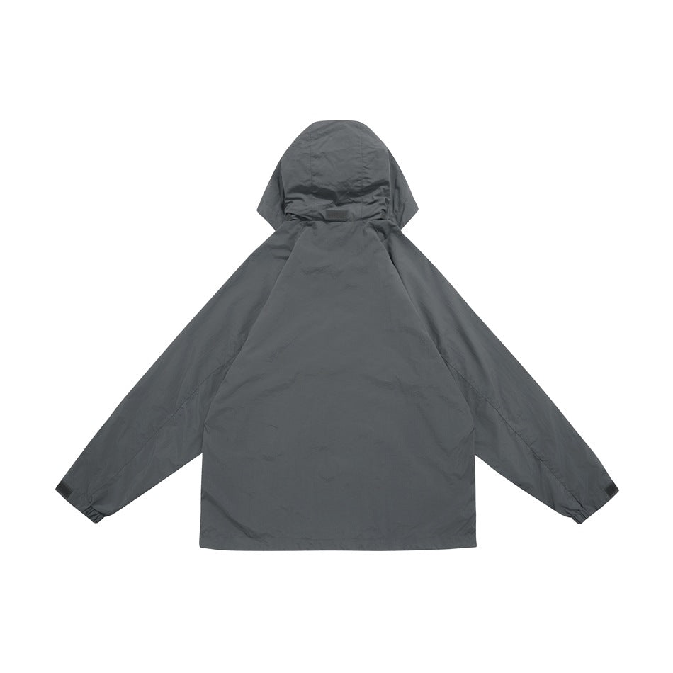 Back view of a dark gray hooded jacket with long sleeves and gathered cuffs on a white background.