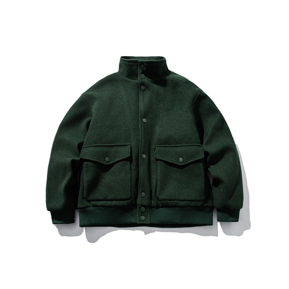 Green stand-collar snap-front jacket with two large flap pockets and ribbed cuffs and hem, flat lay front view