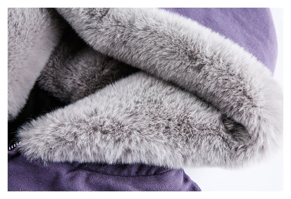 Close-up of a purple jacket with thick gray faux-fur trim around the hood.