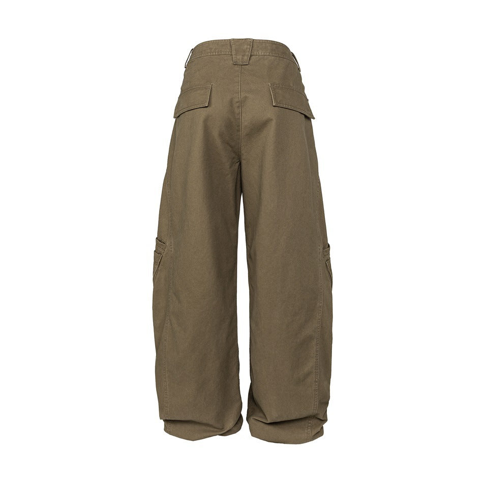 Back view of brown-olive, wide-leg cargo pants with flap pockets at the rear and sides.