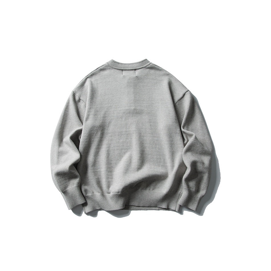 Back view of a light gray long-sleeve knit sweater with a band collar and ribbed cuffs and hem.