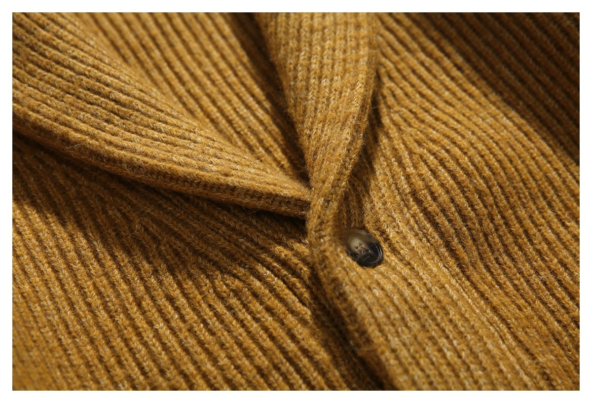 Close-up of the cardigan’s ribbed shawl lapel and button placket.