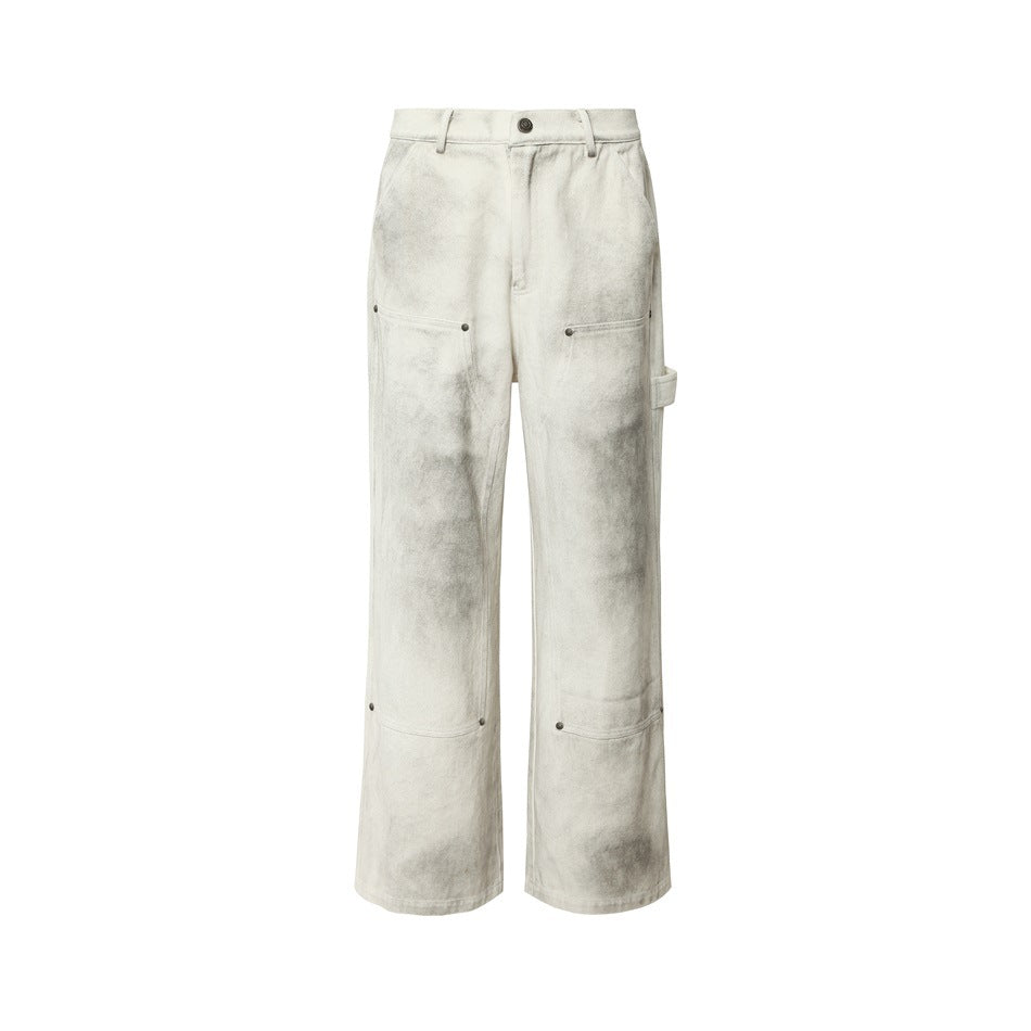 Off-white wide-leg carpenter pants with gray distressed wash, front view with rivets and hammer loop