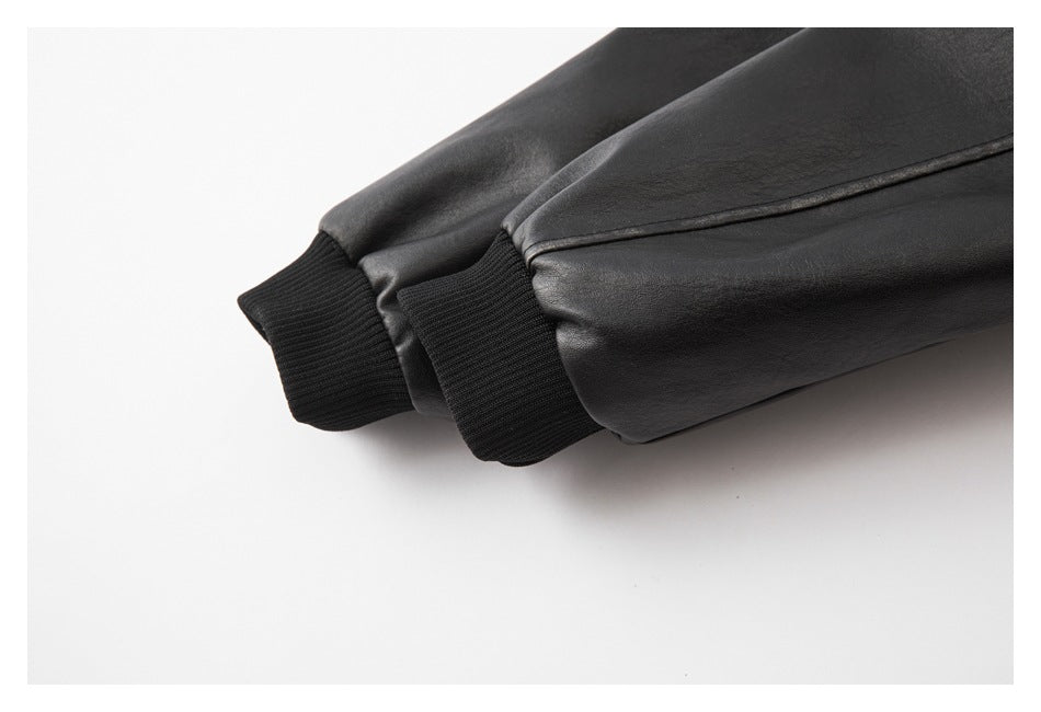 Close-up of the black jacket's sleeves and ribbed cuffs.
