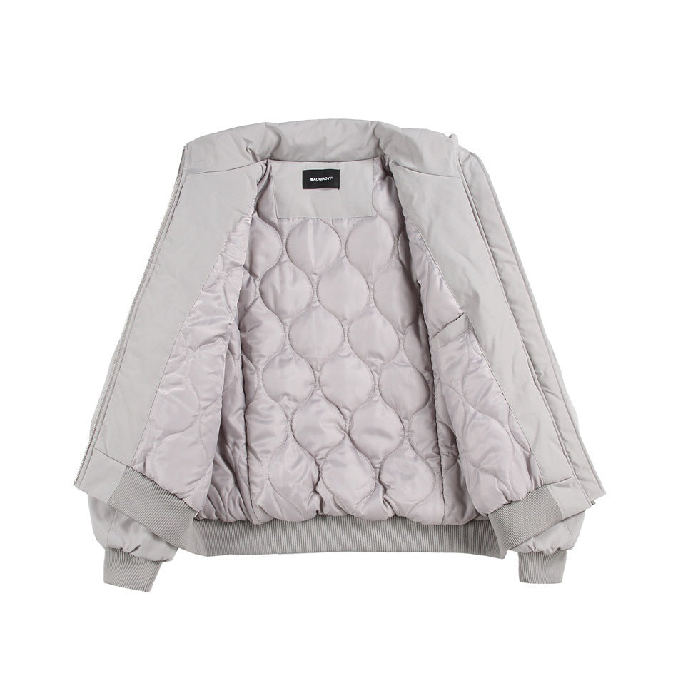 Light gray zip-front jacket laid open to show its quilted interior lining, ribbed cuffs and hem.