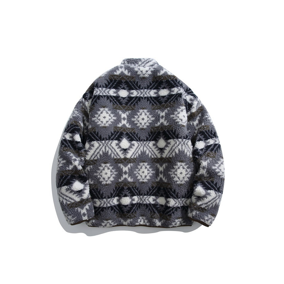 Back view of a fleece jacket in blue-gray, black, and white geometric bands, shown flat against white.