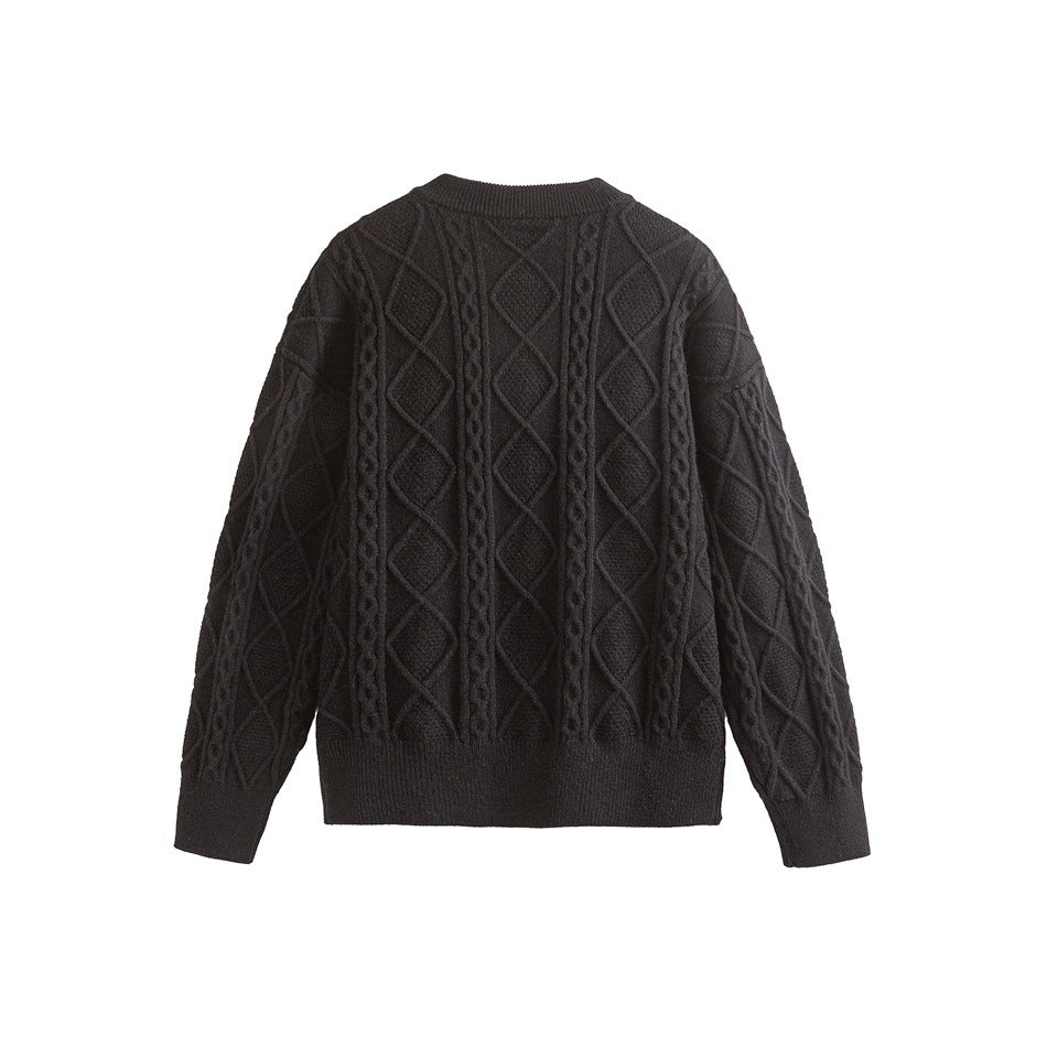 Back view of a black cable-knit sweater with diamond patterns, long sleeves, and ribbed collar, cuffs, and hem.
