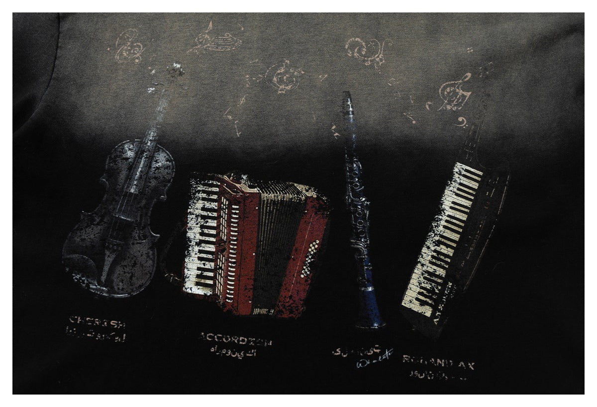 Distressed musical-instrument artwork printed across a dark garment, with small lettering beneath.