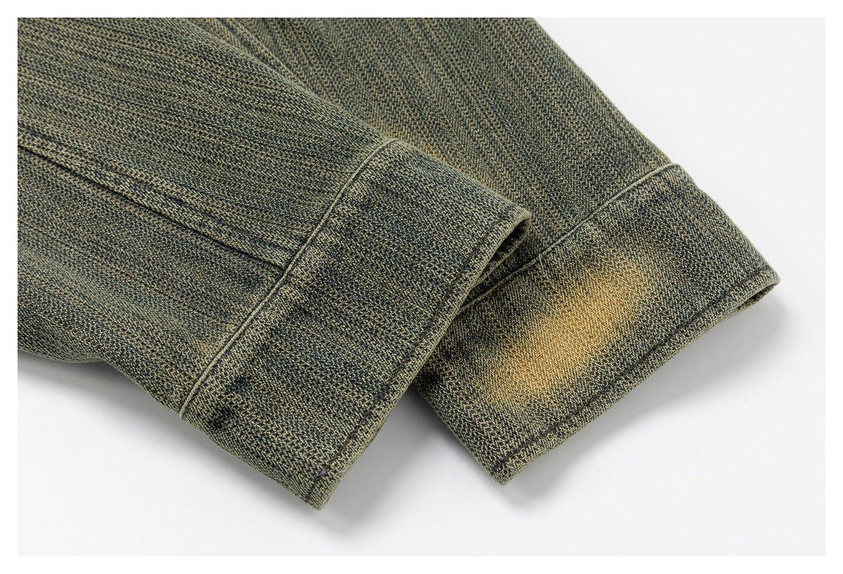 Close-up of wide cuffs on textured olive-gray sleeves, with subtle golden distressing.