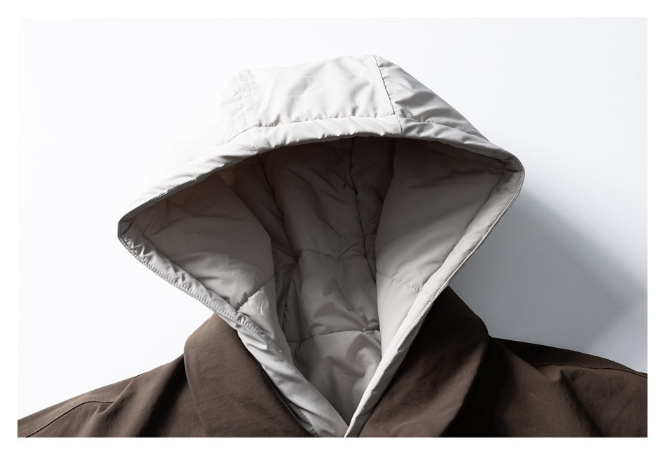 Open light gray hood shows its stitched lining against the dark brown jacket.