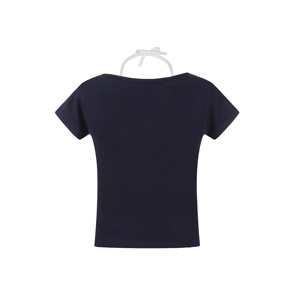 Back view of a plain dark navy short-sleeve T-shirt displayed on a white hanger.