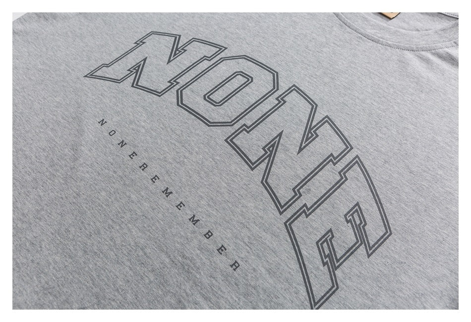Heather-gray T-shirt chest detail with outlined lettering and smaller “ZONE MEMBER” text.