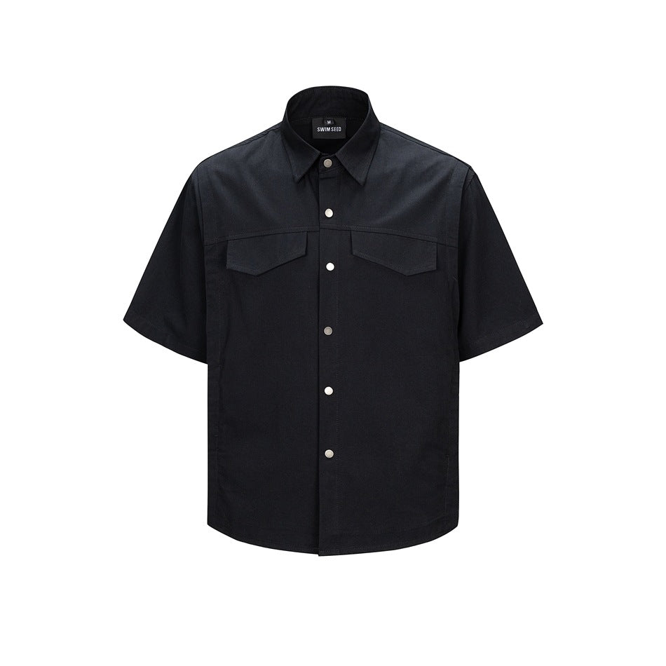 Black short-sleeve button-up shirt with two chest flap pockets and silver snap buttons, front flat view