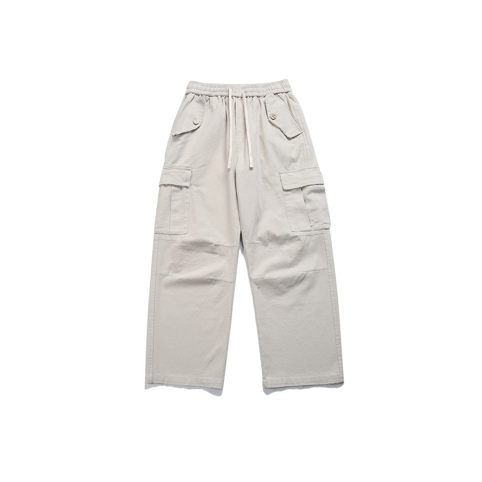 Flat-lay front view of light gray wide-leg cargo pants with a drawstring elastic waist, angled pockets and thigh cargo