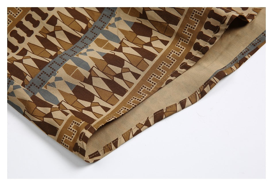 Close-up of the shirt's curved hem, showing the printed outer fabric and beige underside.
