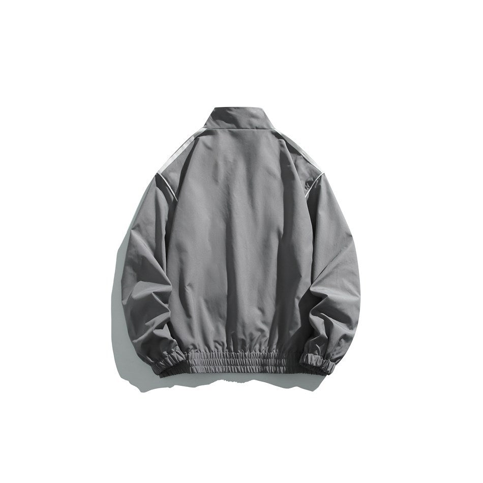Back view of a gray track jacket with a stand collar, white shoulder stripes, and gathered elastic cuffs and hem.