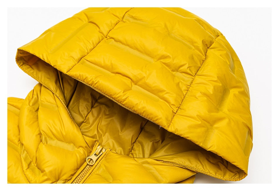 Close-up of the padded mustard-yellow hood and its opening above the jacket zipper.