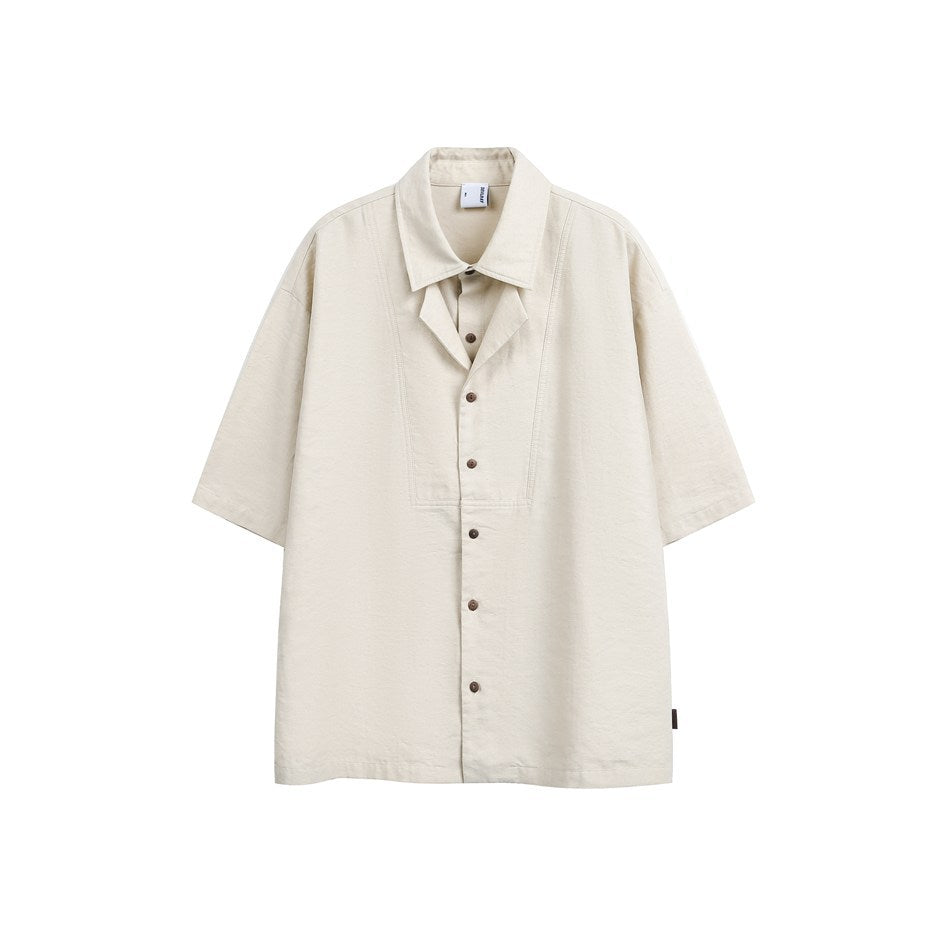Beige short-sleeve button-front shirt with layered faux two-piece collar and brown buttons, flat front view