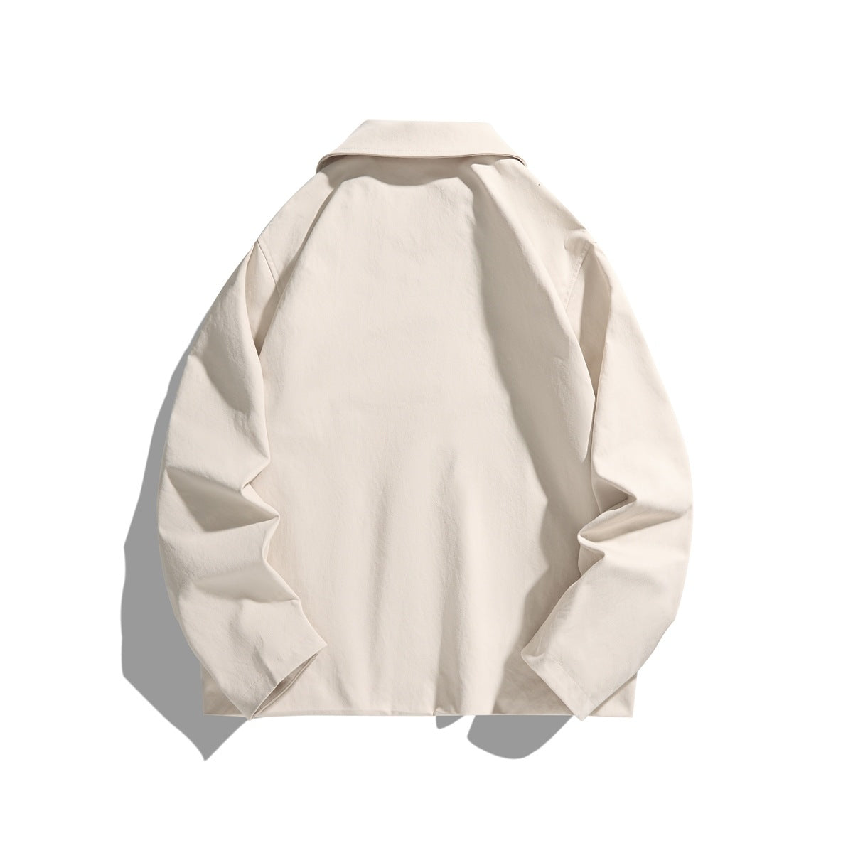 Back view of a cream jacket displayed flat, with a pointed collar and long sleeves.