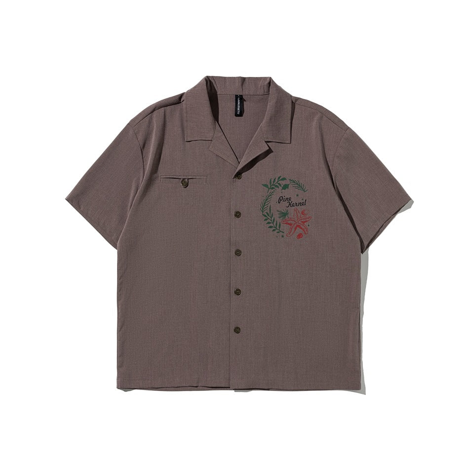 Brownish-taupe short-sleeve camp-collar button shirt with wreath and starfish chest print, flat front view