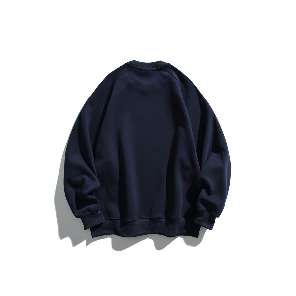 Back view of a solid navy raglan crewneck sweatshirt with ribbed cuffs and hem.