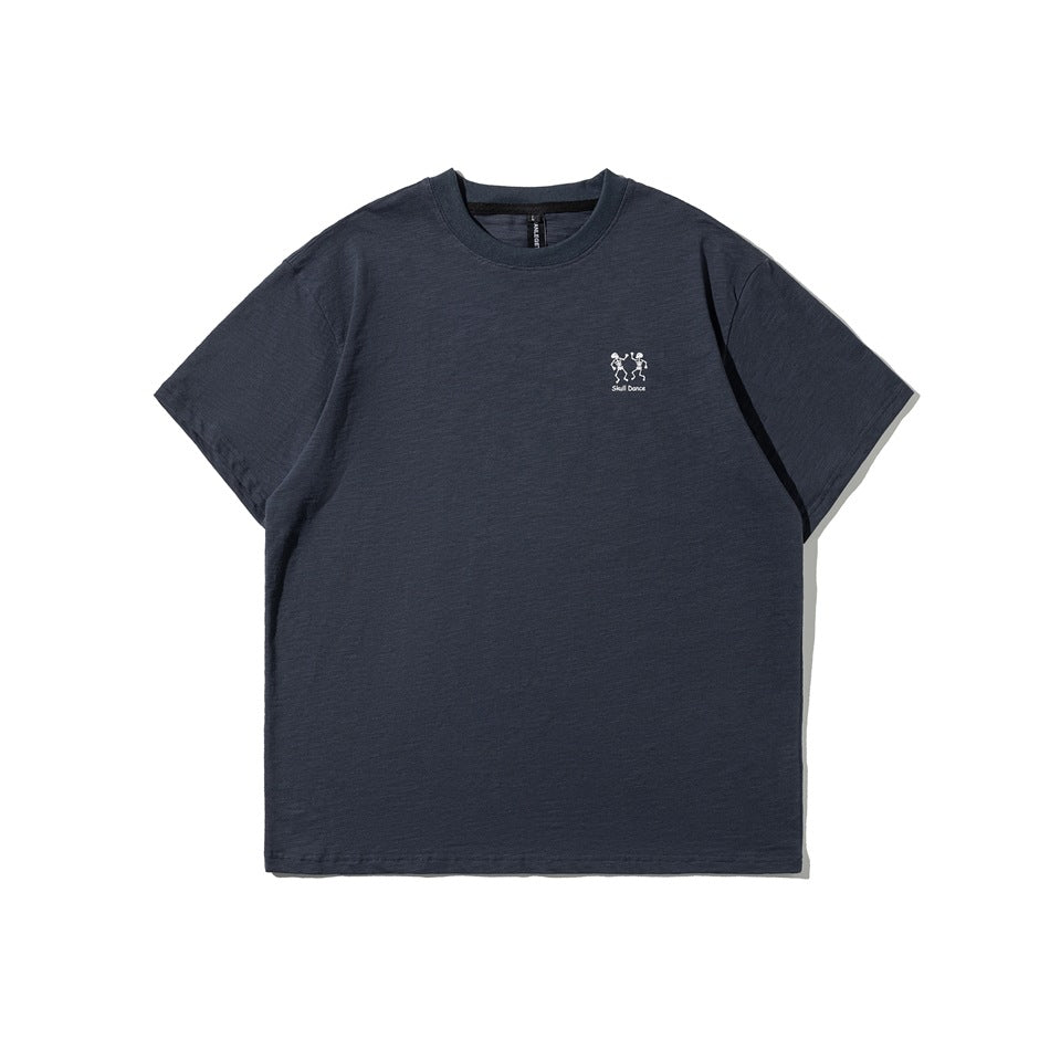 Dark navy short-sleeve crew-neck T-shirt with a small white dancing skeleton graphic on the chest.