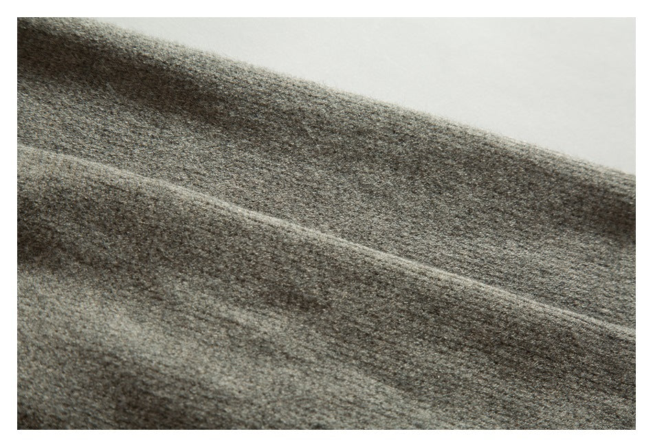 Close-up showing the fine, textured surface of taupe-gray knit fabric.