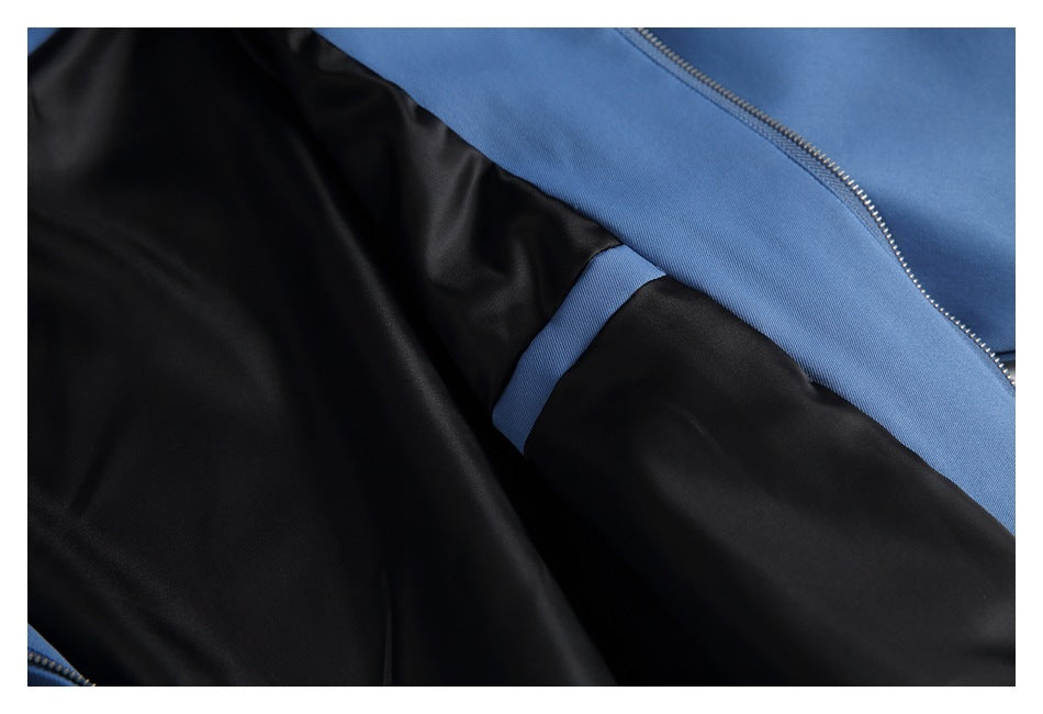 Close-up of the black lining and blue outer fabric inside a garment.