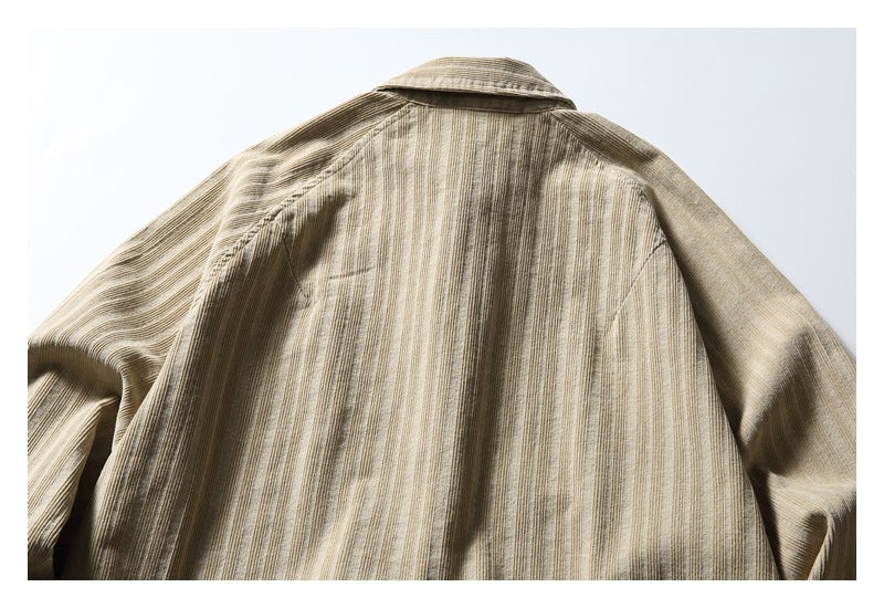 Back of a beige striped collared garment laid flat, shown from the shoulders down.