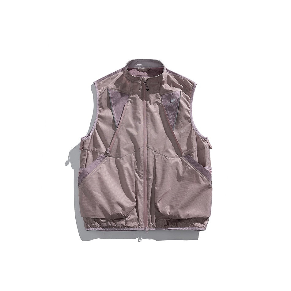 Front view of a dusty mauve sleeveless utility vest with a stand collar, full zipper and oversized front pockets.
