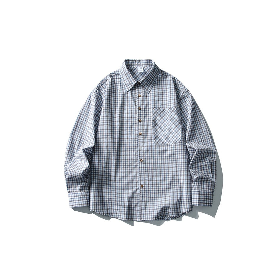 Blue, white and brown plaid long-sleeve button-up shirt laid flat, front view with chest pocket