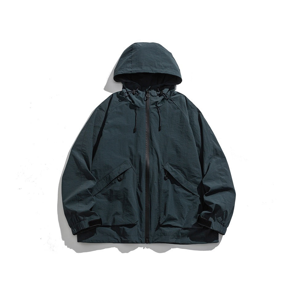 Peacock blue hooded zip jacket with drawcord hood, two large flap pockets and elastic cuffs, flat lay