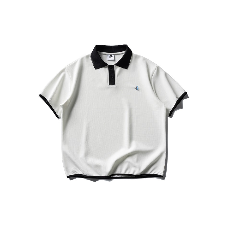 White short-sleeve polo with black collar, placket panel and black trim on sleeves and hem, flat lay front view
