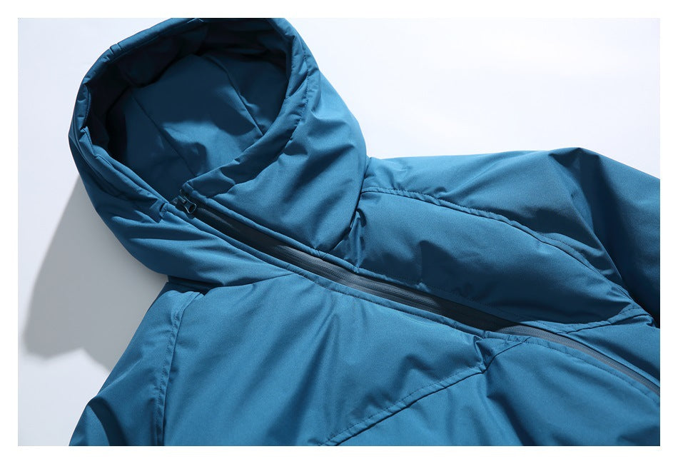 Close-up of a blue jacket’s hood, neckline, and diagonal front zipper.