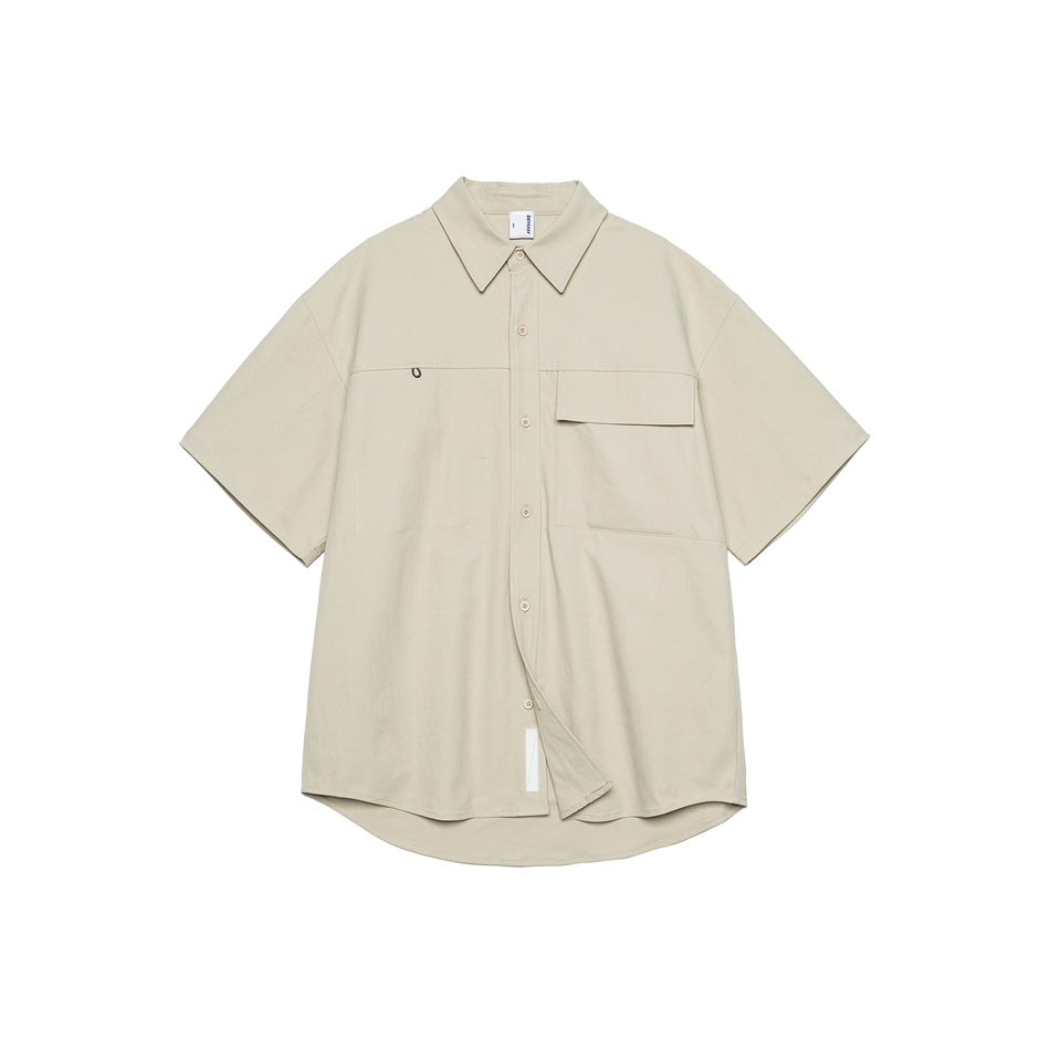 Beige-gray short-sleeve button-up shirt, front flat view, with flap chest pocket and curved hem