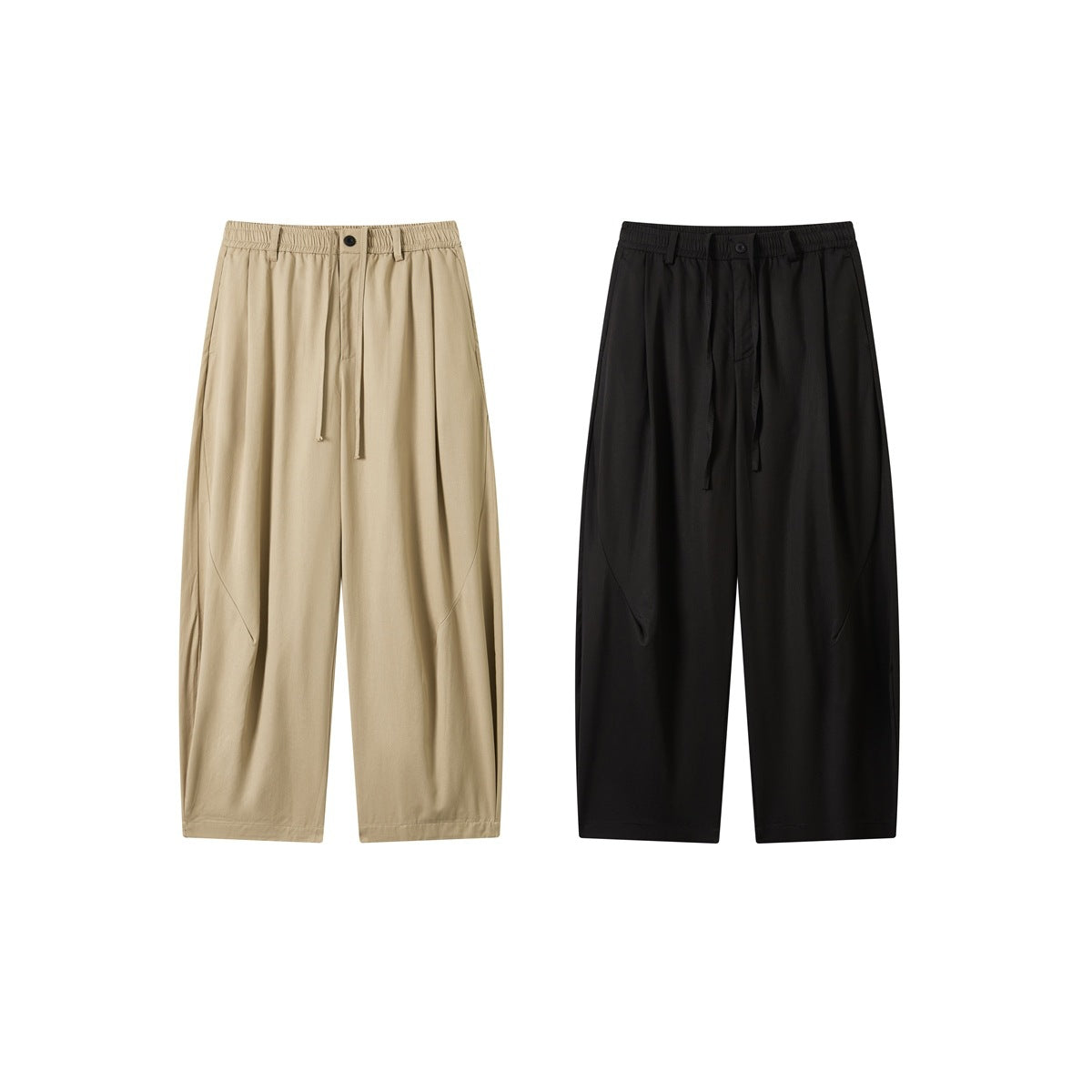 Front view of wide-leg trousers in beige and black, with elastic waistbands, drawstrings and curved seam details.