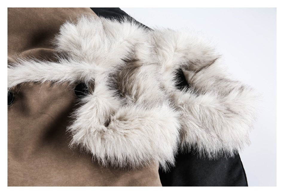 Close-up of thick cream fur trim on the hood of a taupe coat, with part of a black coat visible.