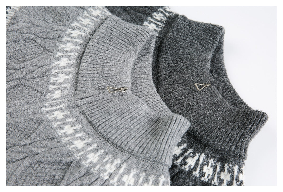 Close-up of two gray sweaters' ribbed collars and small metal fasteners, with patterned knit visible below.