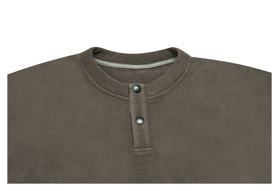 Close front view of an olive-gray fleece pullover with a round neck and two-snap placket.