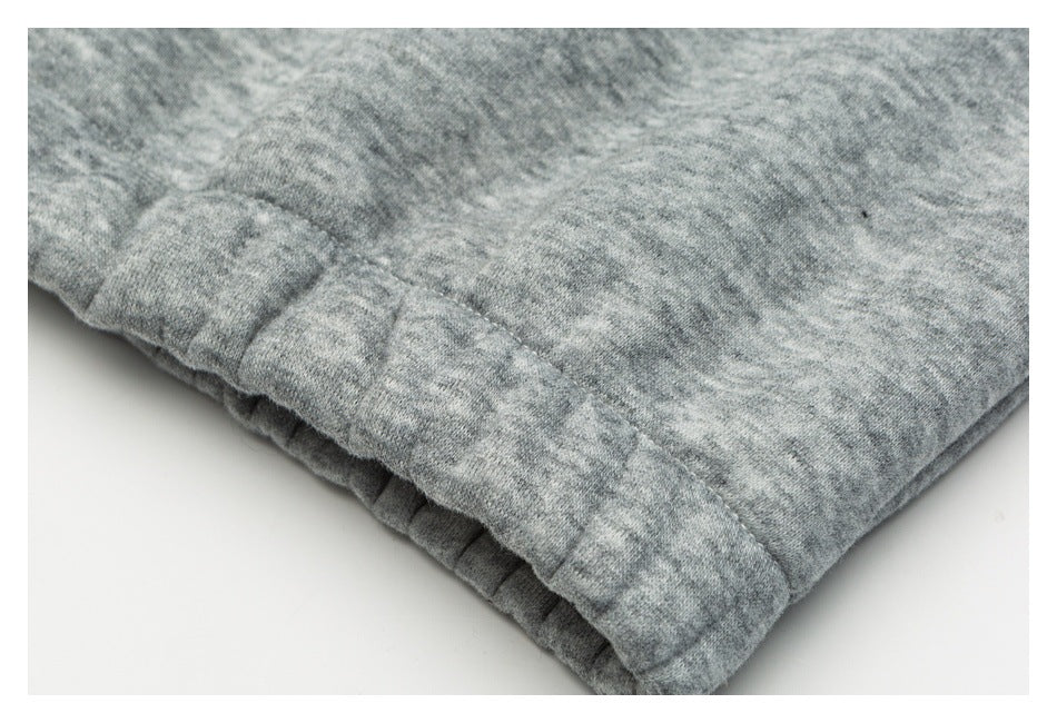 Close-up of a gathered gray fabric edge with stitched seams.