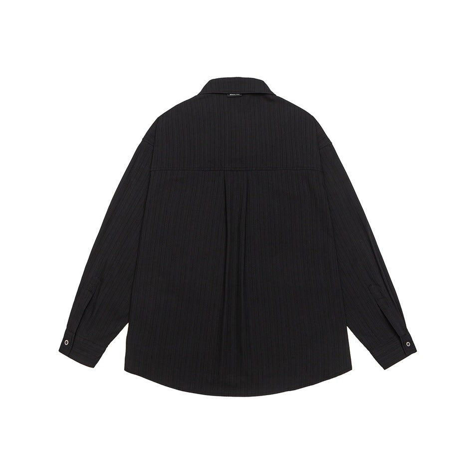 Back view of a black long-sleeve shirt with a pointed collar, vertical ribbed texture and curved hem.