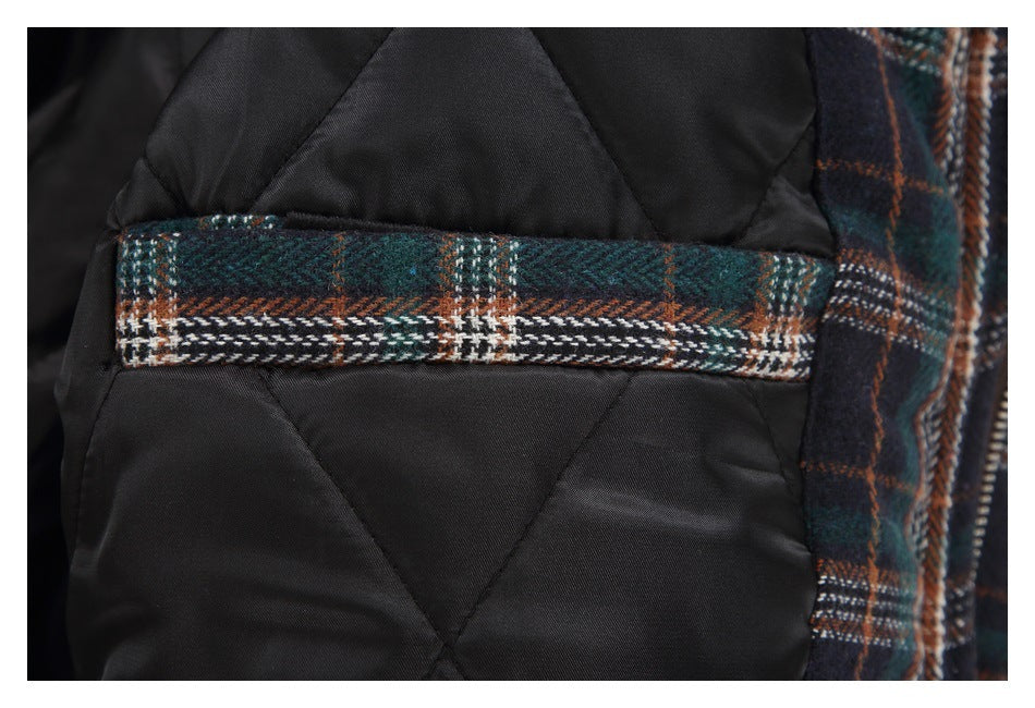 Black quilted lining with a horizontal strip of dark green, navy, rust, and white plaid trim.